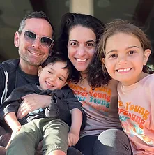 Family of four with their child who is affected by Leigh Syndrome.