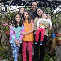 Family of six with their child who is affected by Leigh Syndrome.