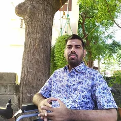Man in wheelchair affected by Leigh Syndrome.