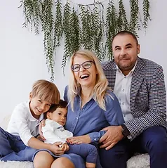 Family of four with their child who is affected by Leigh Syndrome.